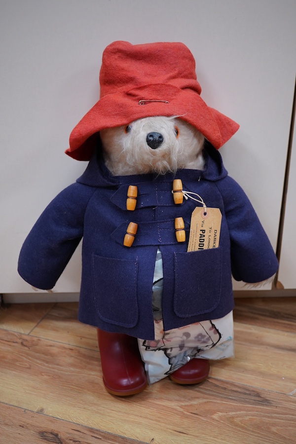 A Paddington bear with clothing and tag, 50cm high. Condition - good